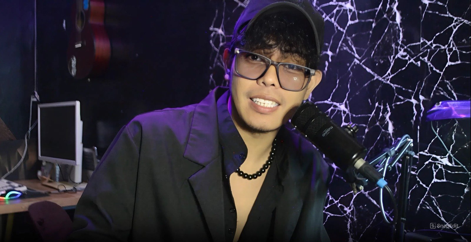 Doji Creates recording a tutorial at his home studio microphone